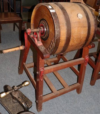 Lot 1266 - ~ An early 20th century staved oak and metal bound butter churn, Hathaway makers, Chippenham,...