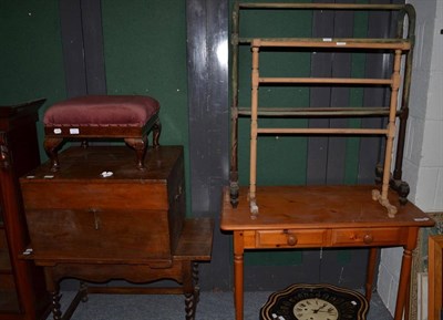 Lot 1290 - ~ A pine two drawer hall table, modern, raised on turned legs, 95cm wide; together with a green...