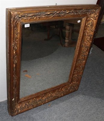 Lot 1298 - ~ A 19th century gilt and gesso mirror with acanthus decorated frame with a later rectangular...