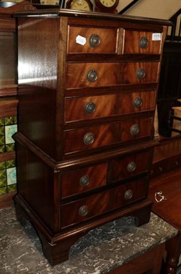 Lot 1315 - A reproduction miniature chest on chest