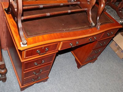 Lot 1318 - A reproduction writing desk with leather top