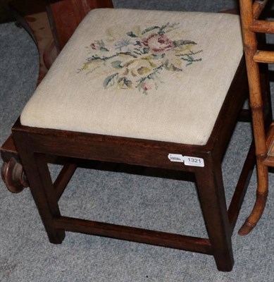 Lot 1321 - A George III oak dressing stool with needlework seat