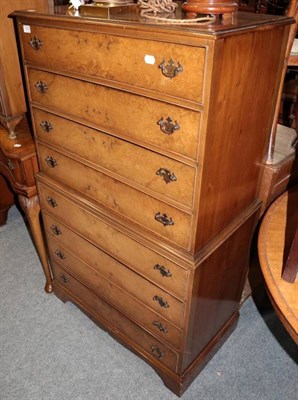 Lot 1323 - A reproduction walnut seven drawer bow fronted chest; a walnut bedside cupboard; a fitted...