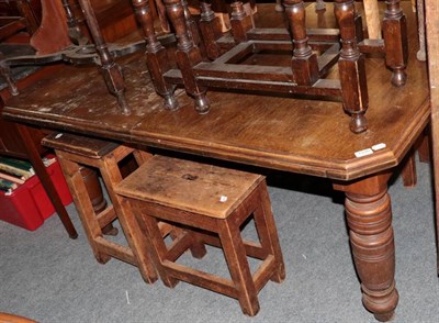 Lot 1330 - ~ A Victorian oak extending dining table, late 19th century, of canted rectangular form raised...