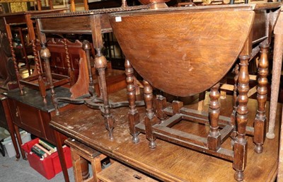 Lot 1331 - A small oak drop leaf table; an oak side table with flattened stretcher and an oak occasional table