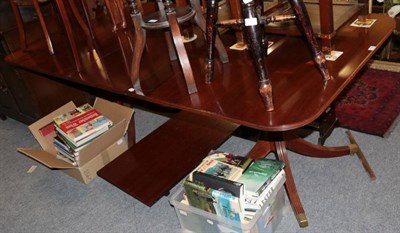 Lot 1339 - A George III style mahogany twin pedestal dining table with two additional leaves