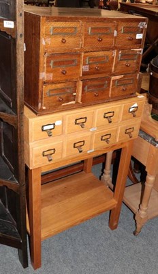 Lot 1342 - A small set of oak index drawers together with a light oak set labelled ''Libraco, London'', on...