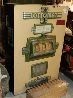 Lot 1349 - ~ A Lottomat penny slot machine with painted wooden case, 70.5cm high