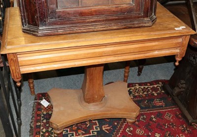 Lot 1355 - ~ A Victorian pitch pine rectangular side table, the moulded top above shaped column support...