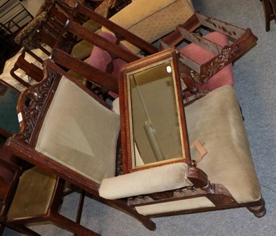 Lot 1368 - ~ A Victorian nursing chair, upholstered in pink velvet raised on mahogany turned tapering forelegs