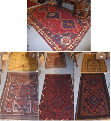 Lot 1380 - ~ Kashgai Carpet, South West Iran, the claret field with three medallions enclosed by narrow...