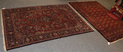 Lot 1386 - Two Louis de Portere machine made rugs, of Bokhara and Kashan design (2)