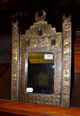 Lot 1391 - Randia Fahmy brass mounted ''Eastern'' style easel framed mirror and label to reverse   Provenance