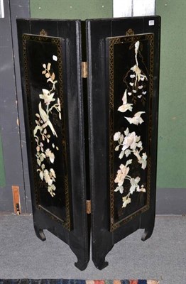 Lot 1410 - A 20th century Japanese lacquered and ebonised two-fold screen, 121cm high