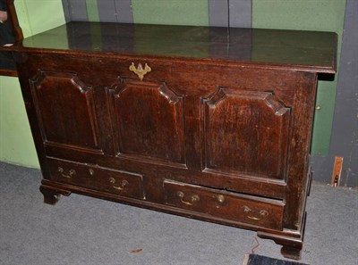 Lot 1411 - An 18th century oak chest with hinged lid and two drawers