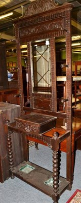 Lot 1429 - A Victorian carved oak hall stand