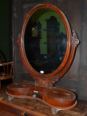 Lot 1434 - ~ A Victorian mahogany toilet mirror, circa 1870, with an oval mirror plate and moulded frame...