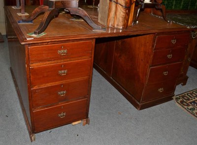 Lot 1435 - ~ An early Victorian mahogany partners desk, the moulded top with a brown and gilt leather...