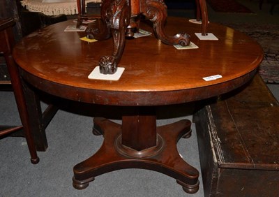 Lot 1449 - ~ A Victorian mahogany circular breakfast table, the flip top above tapering support with...