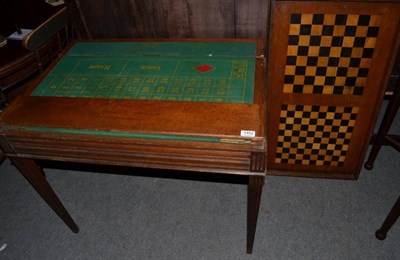 Lot 1452 - ~ A Victorian oak gaming table with removable lid enclosing a chess and draughts board with two...