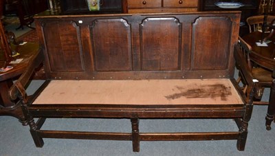 Lot 1458 - George III oak panel back settle with later seat, 185cm wide