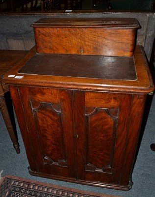 Lot 1464 - ~ A Victorian walnut davenport, late 19th century, with a hinged lid enclosing two small...