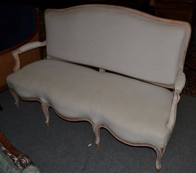 Lot 1470 - A 19th century French limewood three seater sofa