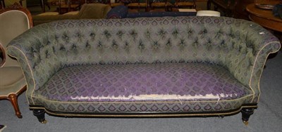 Lot 1479 - A Victorian ebonised and gilt metal mounted three seater sofa, upholstered in dark green and purple