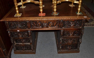 Lot 1499 - Victorian carved oak double pedestal desk with leather top, 121cm wide