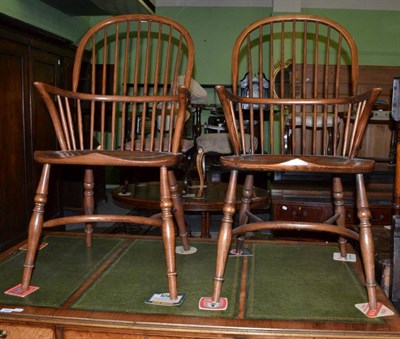 Lot 1503 - Pair of ash spindle back Windsor armchairs with moulded seats and crinoline stretchers, 53cm wide