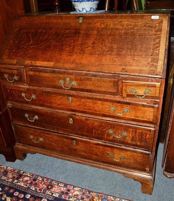 Lot 1509 - George III oak and mahogany cross-banded bureau, 105cm wide