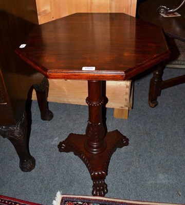 Lot 1527 - A Regency rosewood octagonal side table on lion paw supports