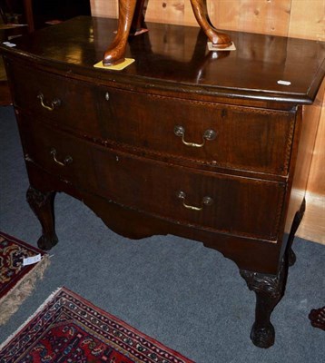 Lot 1528 - A mahogany two drawer bow fronted chest on carved legs