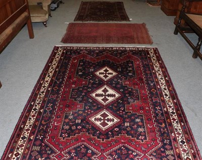 Lot 1543 - Afshar Rug, South East Iran, the indigo field with three ivory medallions enclosed by narrow...