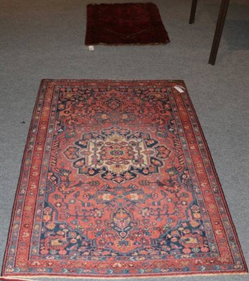 Lot 1547 - Hamadan rug, Iranian Kurdistan, the madder field centred by a flowerhead medallion framed by narrow