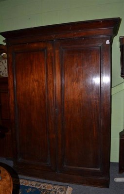 Lot 1564 - ~ A Victorian mahogany wardrobe, the cornice above two panel doors enclosing hanging space and four