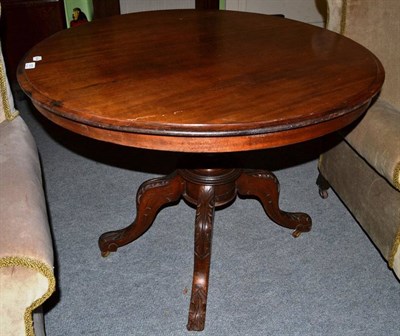 Lot 1570 - A Victorian mahogany circular flip-top breakfast table, the moulded top on a baluster turned...