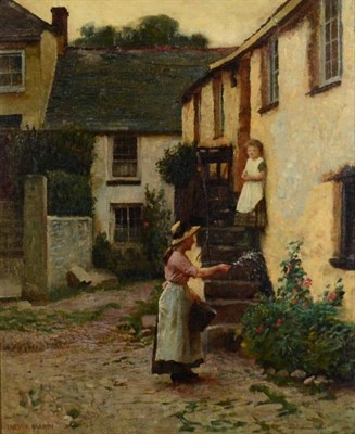 Lot 26 - Trevor Haddon (1864-1941) Lady tending a bed of flowers outside a cottage  Signed, oil on...
