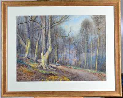 Lot 147 - Willie Stephenson (fl.1893-1938) Figure in a woodland before a village Signed, watercolour, 44cm by
