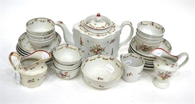 Lot 247 - A Composite Newhall Porcelain Tea Service, circa 1790, painted with flowersprays within floral...