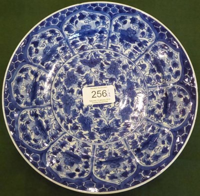 Lot 256 - An English Delft Charger, probably Bristol, circa 1760, painted in blue with figures in a river...
