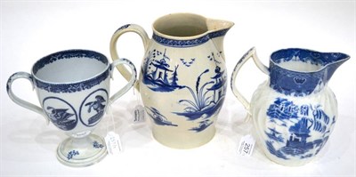 Lot 257 - A Leeds Pottery Pearlware Loving Cup, circa 1800, printed in underglaze blue with the Royal Arms, a