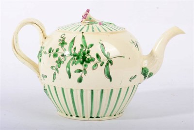 Lot 261 - A Leeds Creamware Teapot and Cover, circa 1780, painted in green monochrome with stylised...