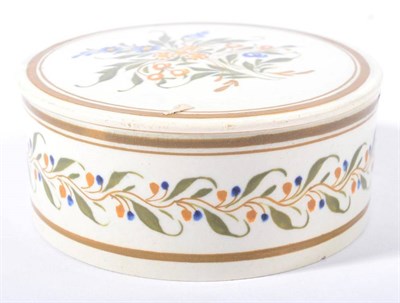 Lot 263 - A Prattware Circular Snuff Box and Screw Top, circa 1800, typically painted with stylised...