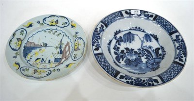 Lot 264 - An English Delft Dish, circa 1760, painted in colours with a fenced garden within panelled borders