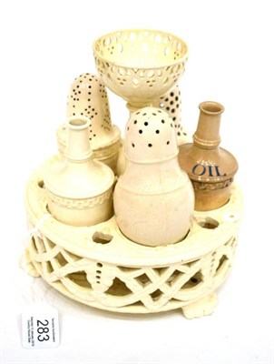 Lot 283 - A Wedgwood Creamware Cruet Stand, circa 1820, with five compartments above a pierced basketwork...