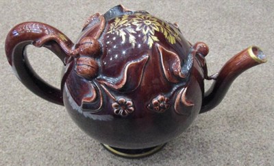 Lot 291 - A Brameld Treacle Glazed Cadogan Teapot, circa 1830, of traditional form, inscribed in gilt HOT...