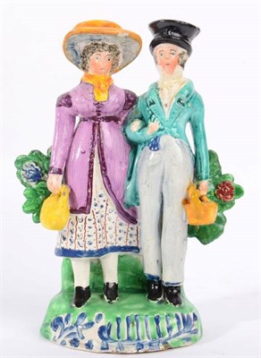 Lot 297 - A Staffordshire Pearlware Figure Group of the Dandies, early 19th century, the fashionably...