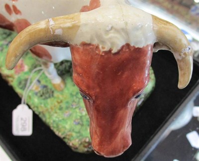 Lot 298 - A Large Staffordshire Pottery Cow Spill Vase, early 19th century, the naturalistically modelled and