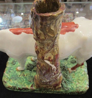 Lot 298 - A Large Staffordshire Pottery Cow Spill Vase, early 19th century, the naturalistically modelled and
